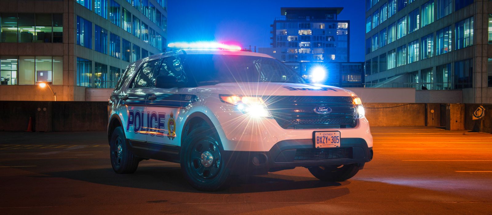 Ottawa Police cruiser at night with lights on